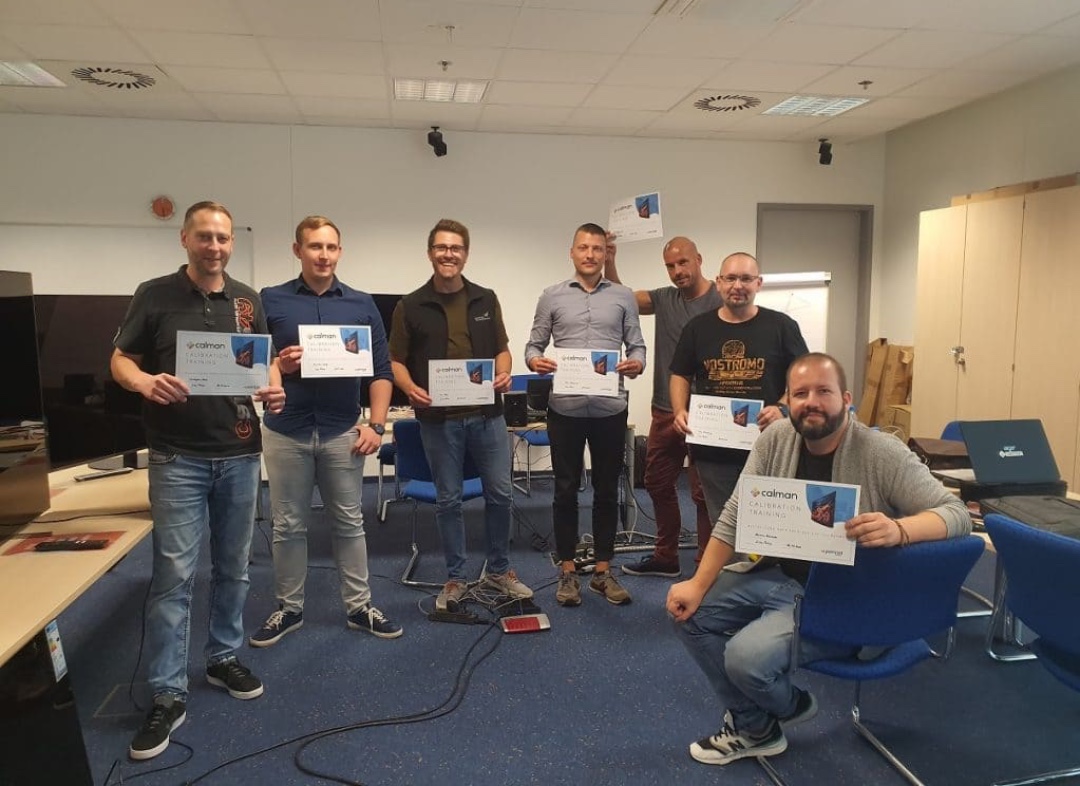 group of people holding up Calman academy certificate