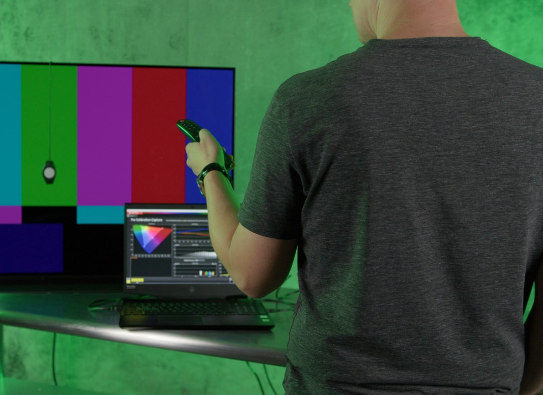 man calibrating tv