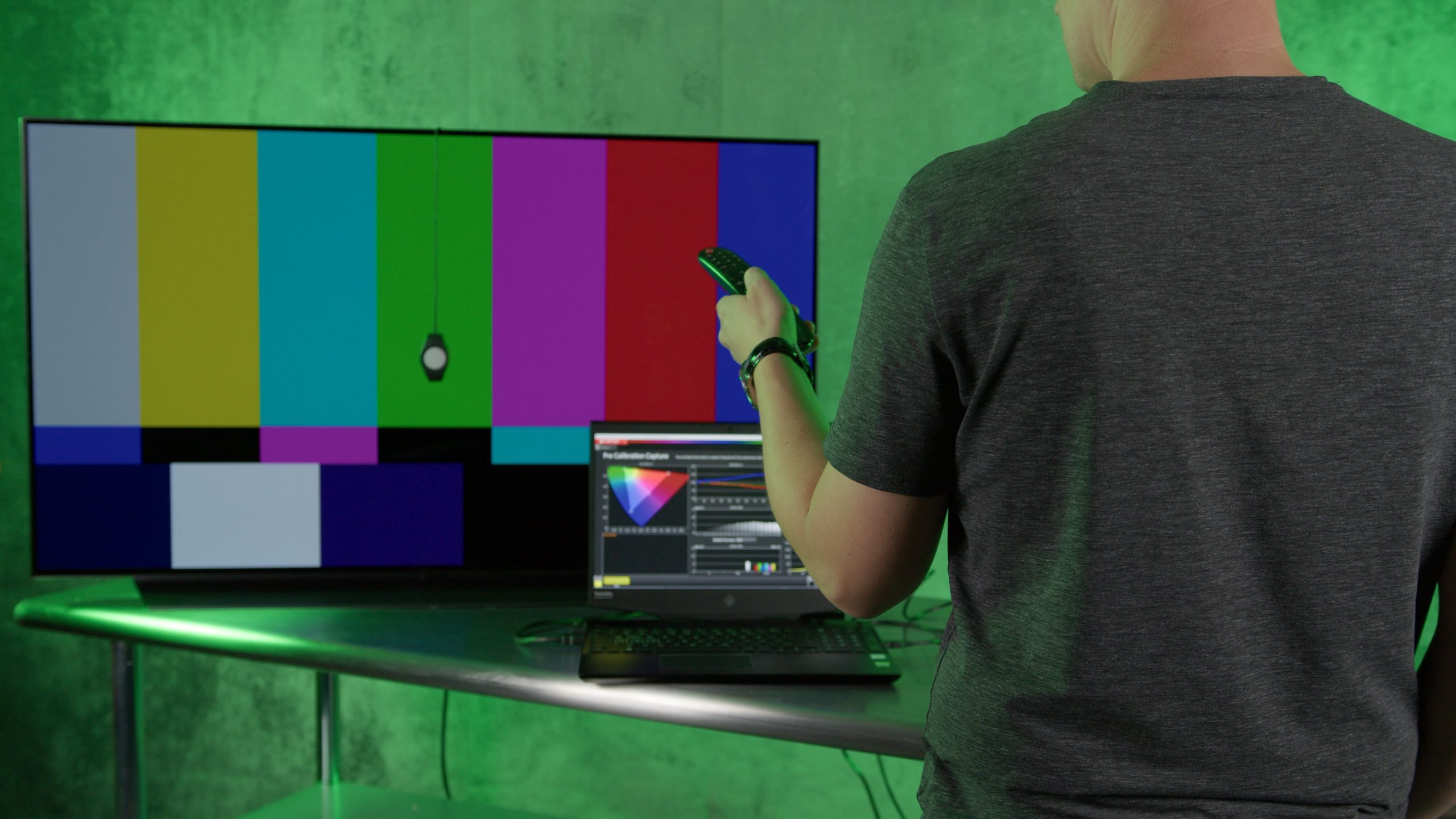 man calibrating tv