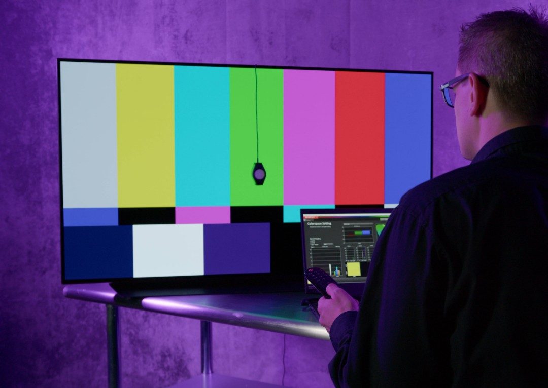 man calibrating tv